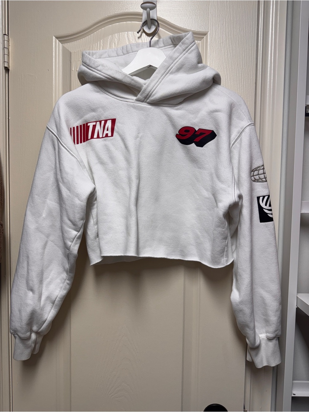 TNA White Cropped Hoodie Sweater with Red Graphic Accents
